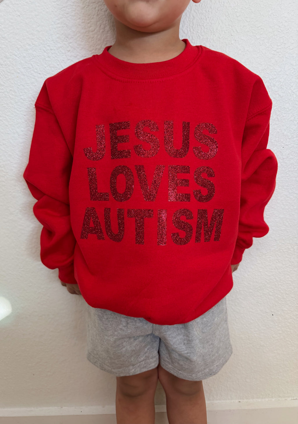 Toddler + Youth “Jesus Loves Autism” Christmas Red Sparkle Crewneck