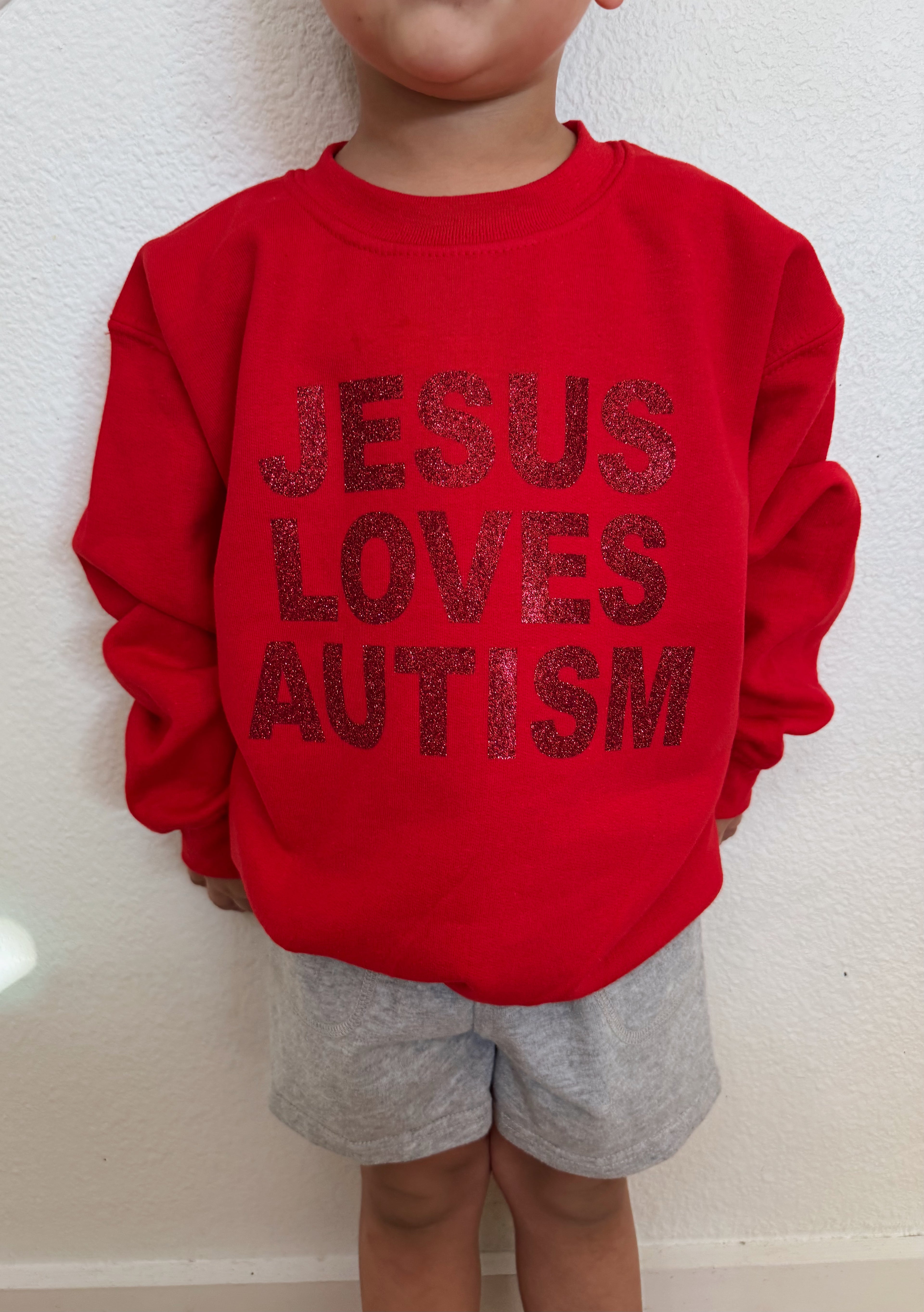 Toddler + Youth “Jesus Loves Autism” Christmas Red Sparkle Crewneck