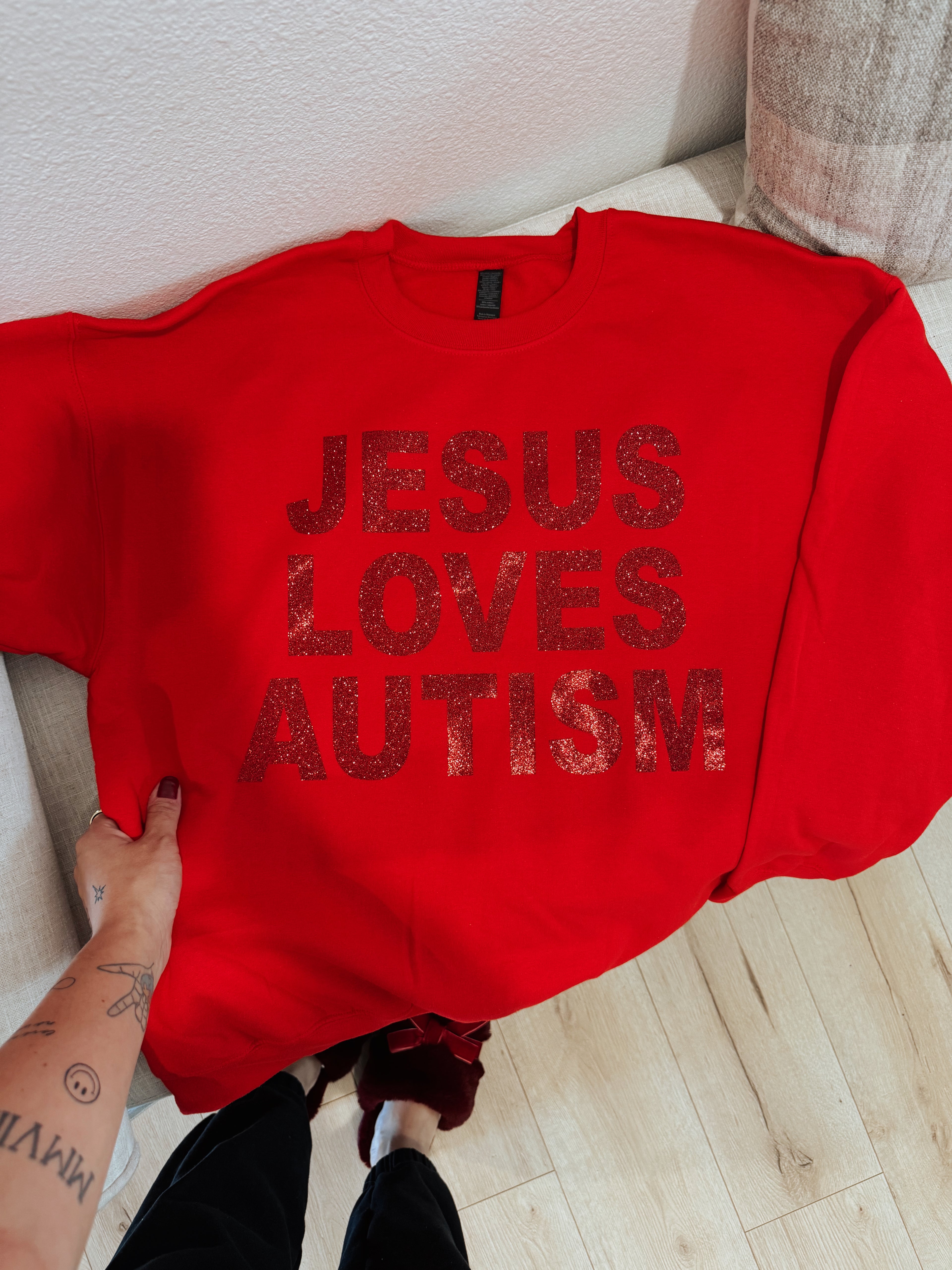 Unisex “Jesus Loves Autism” Christmas Red Sparkle Crewneck