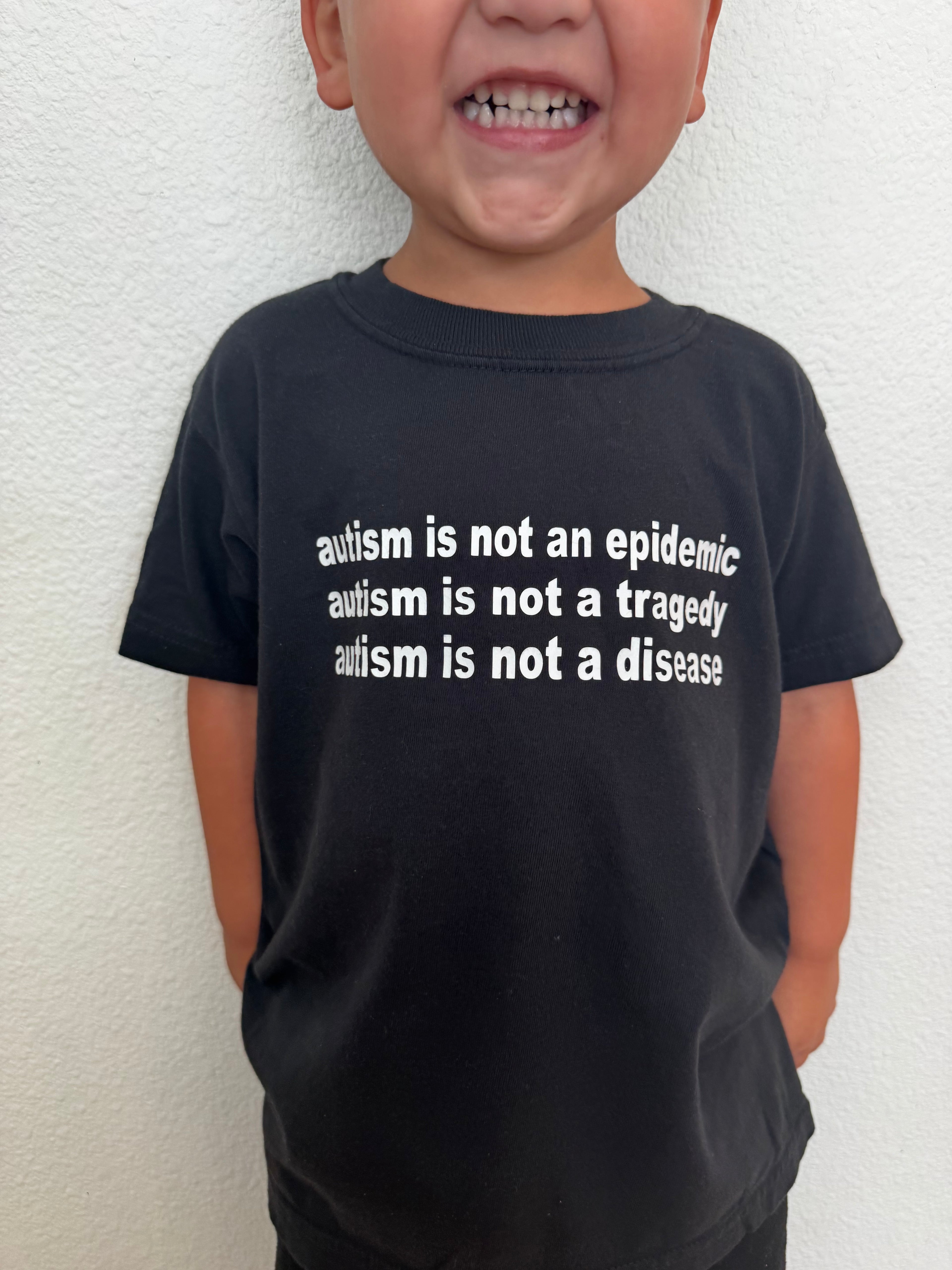 Toddler + Youth “Autism is not an epidemic, a tragedy, or disease” T-Shirt