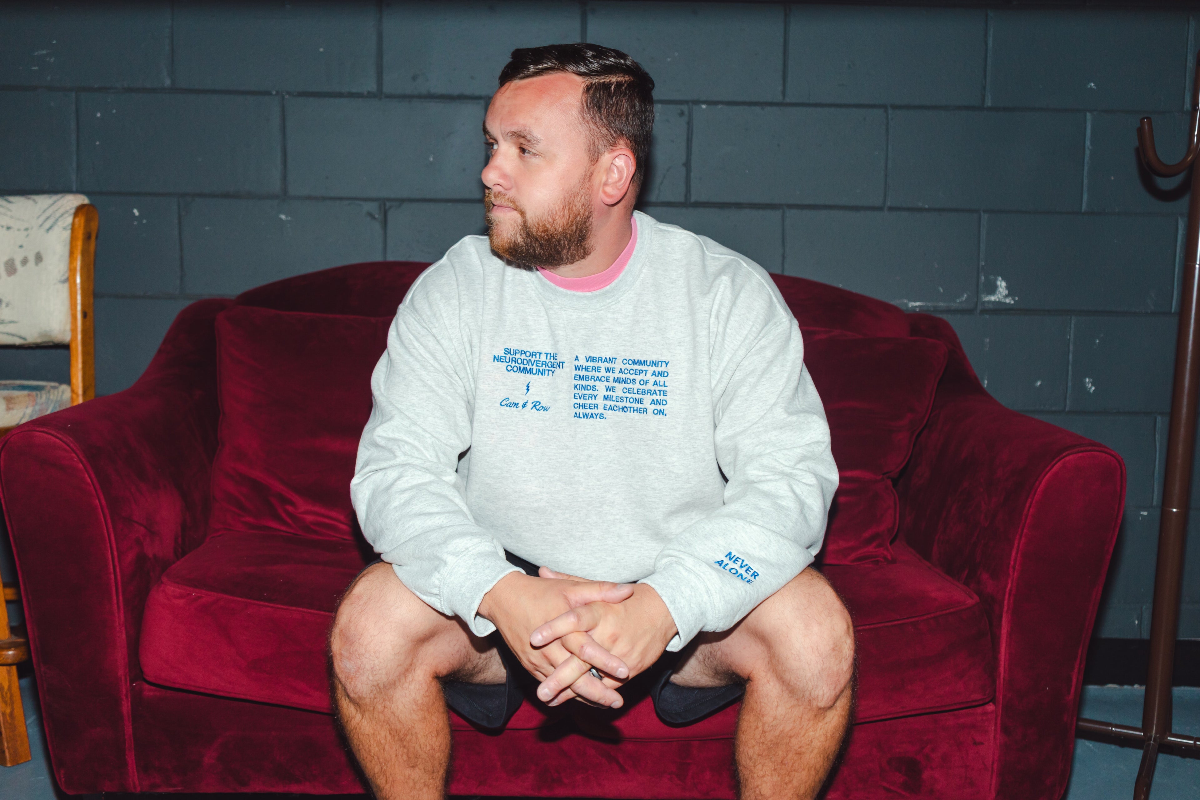 Unisex "Never Alone" Embroidered Sweatshirt