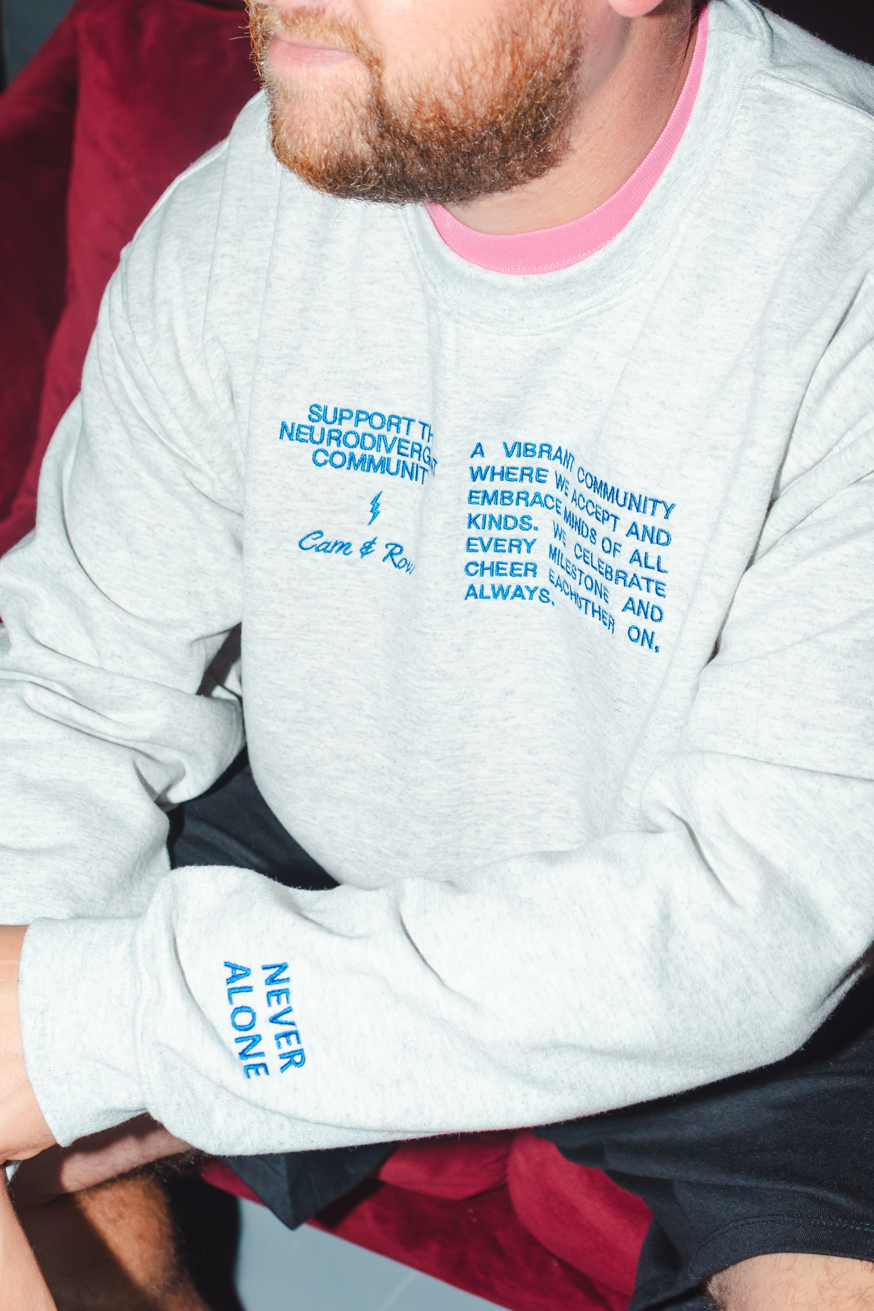 Unisex "Never Alone" Embroidered Sweatshirt