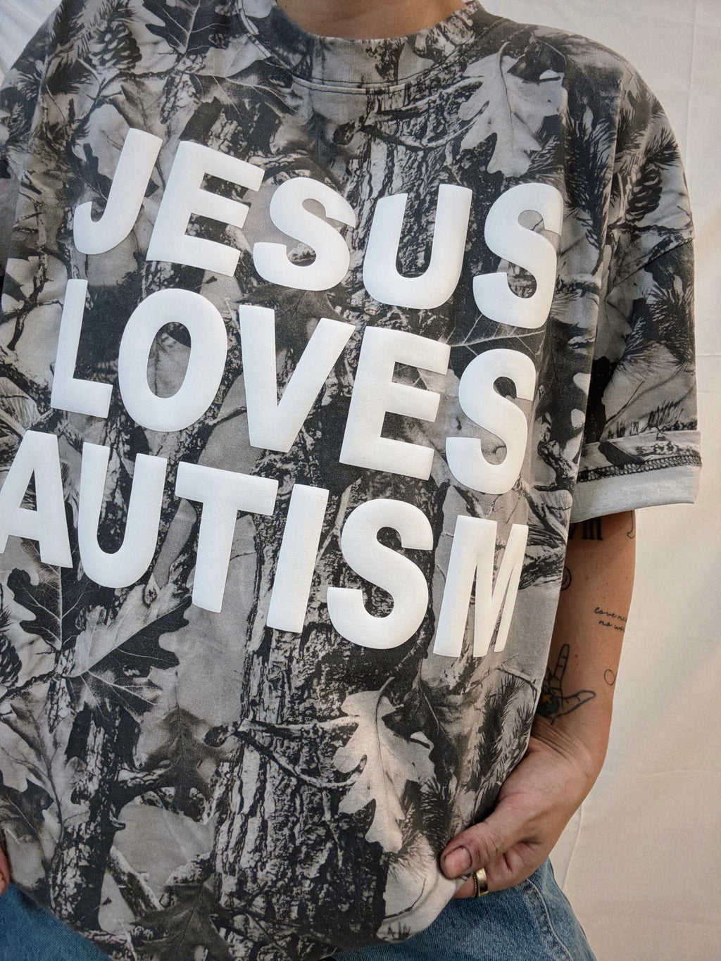 Snow Camo "Jesus Loves Autism" Cotton Collective T-Shirt