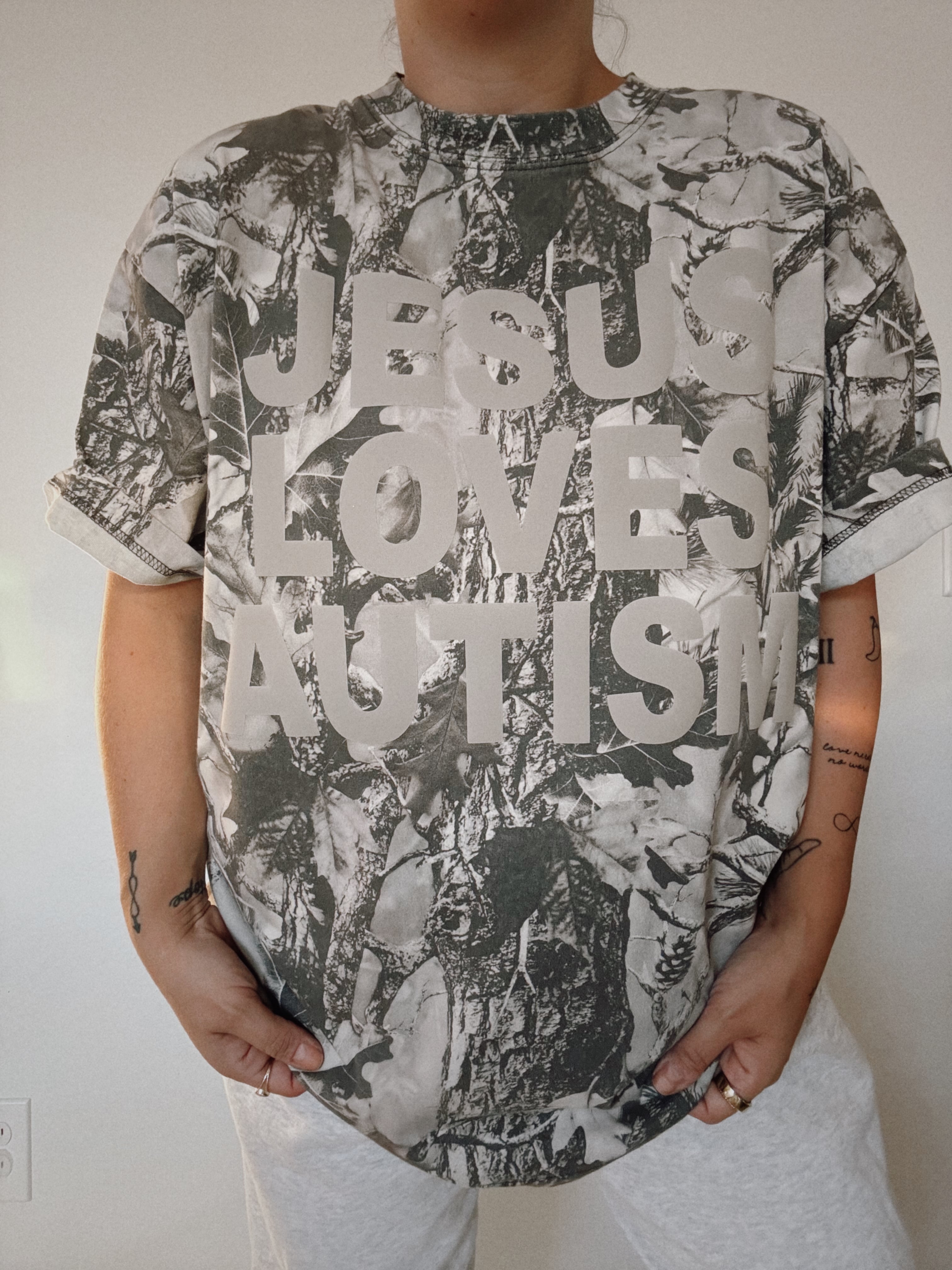 Snow Camo "Jesus Loves Autism" Cotton Collective T-Shirt
