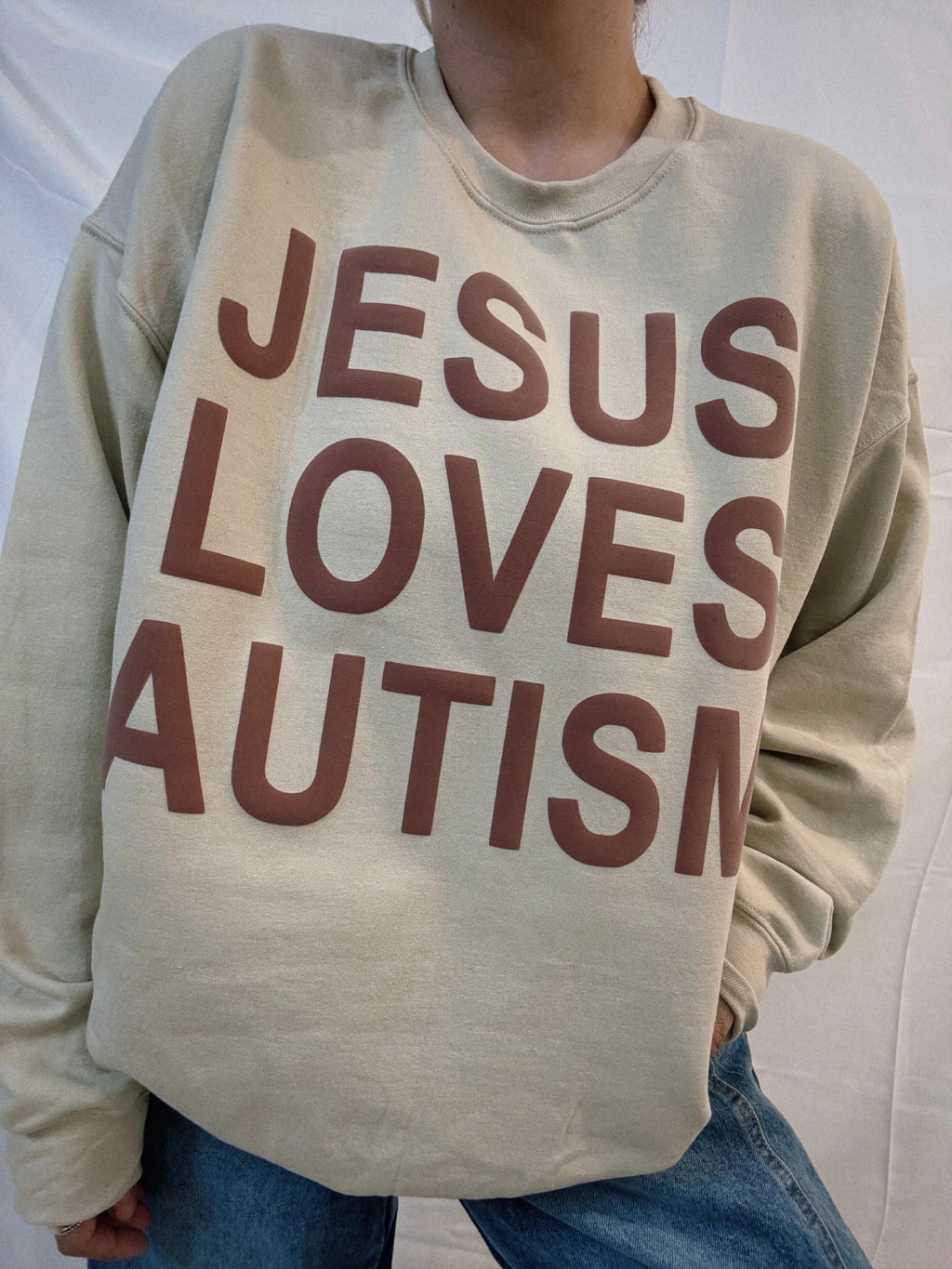 Unisex Tan "Jesus Loves Autism" Puff Print Sweatshirt