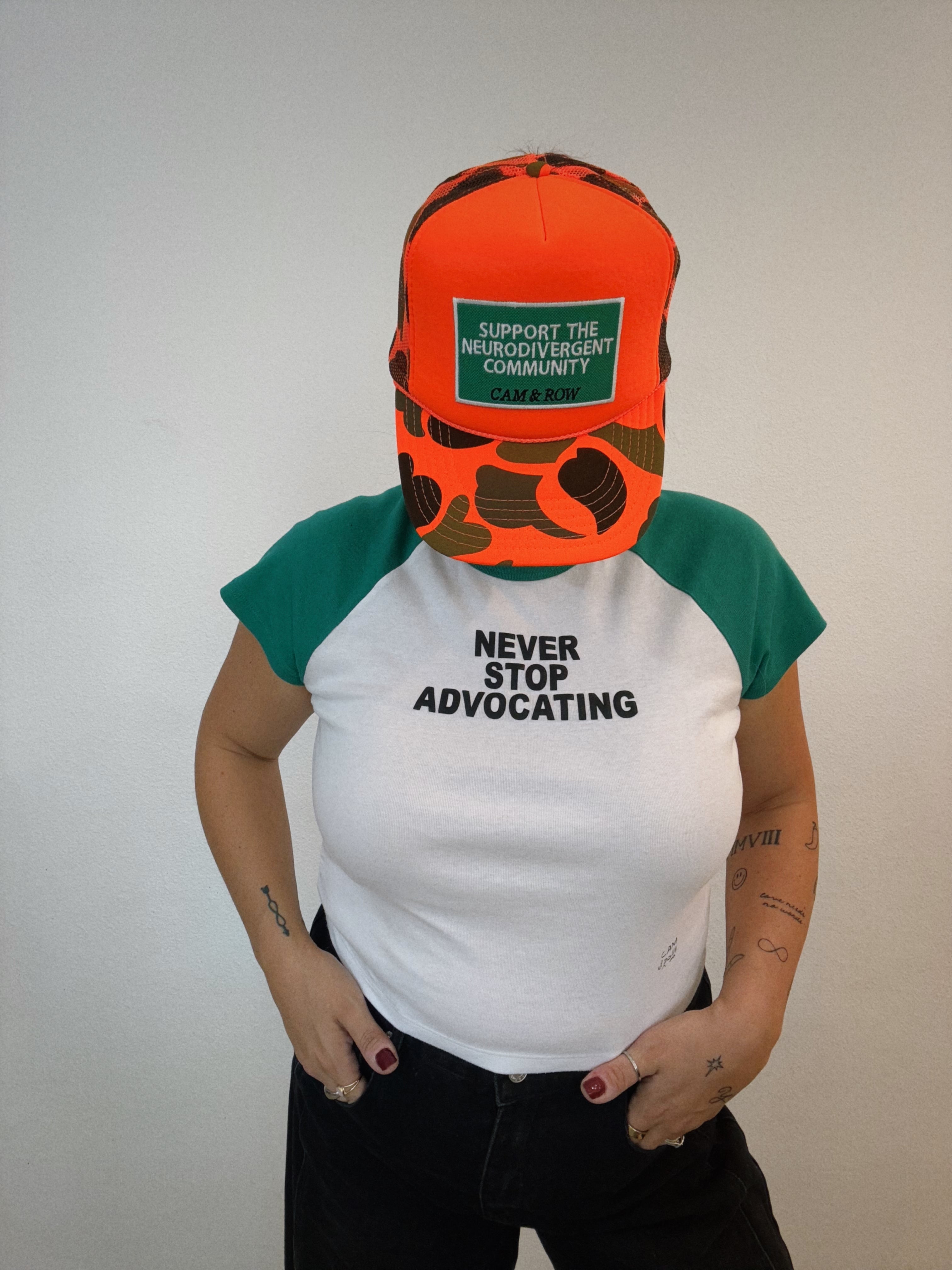 Women's "Never Stop Advocating" Puff Print Micro Ribbed Baby Tee