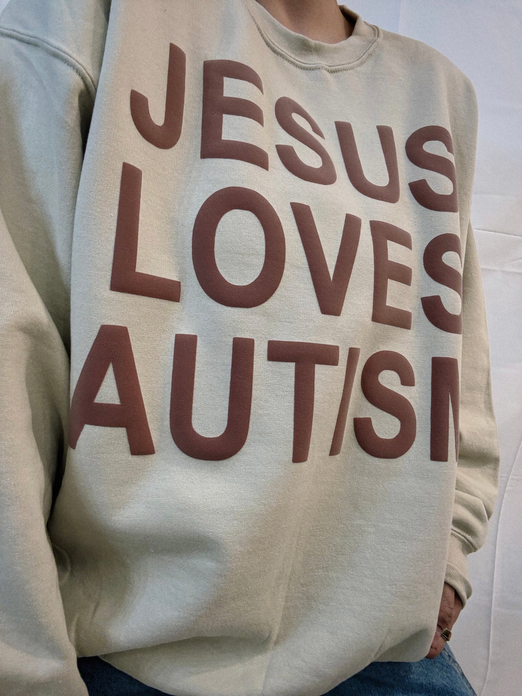 Unisex Tan "Jesus Loves Autism" Puff Print Sweatshirt
